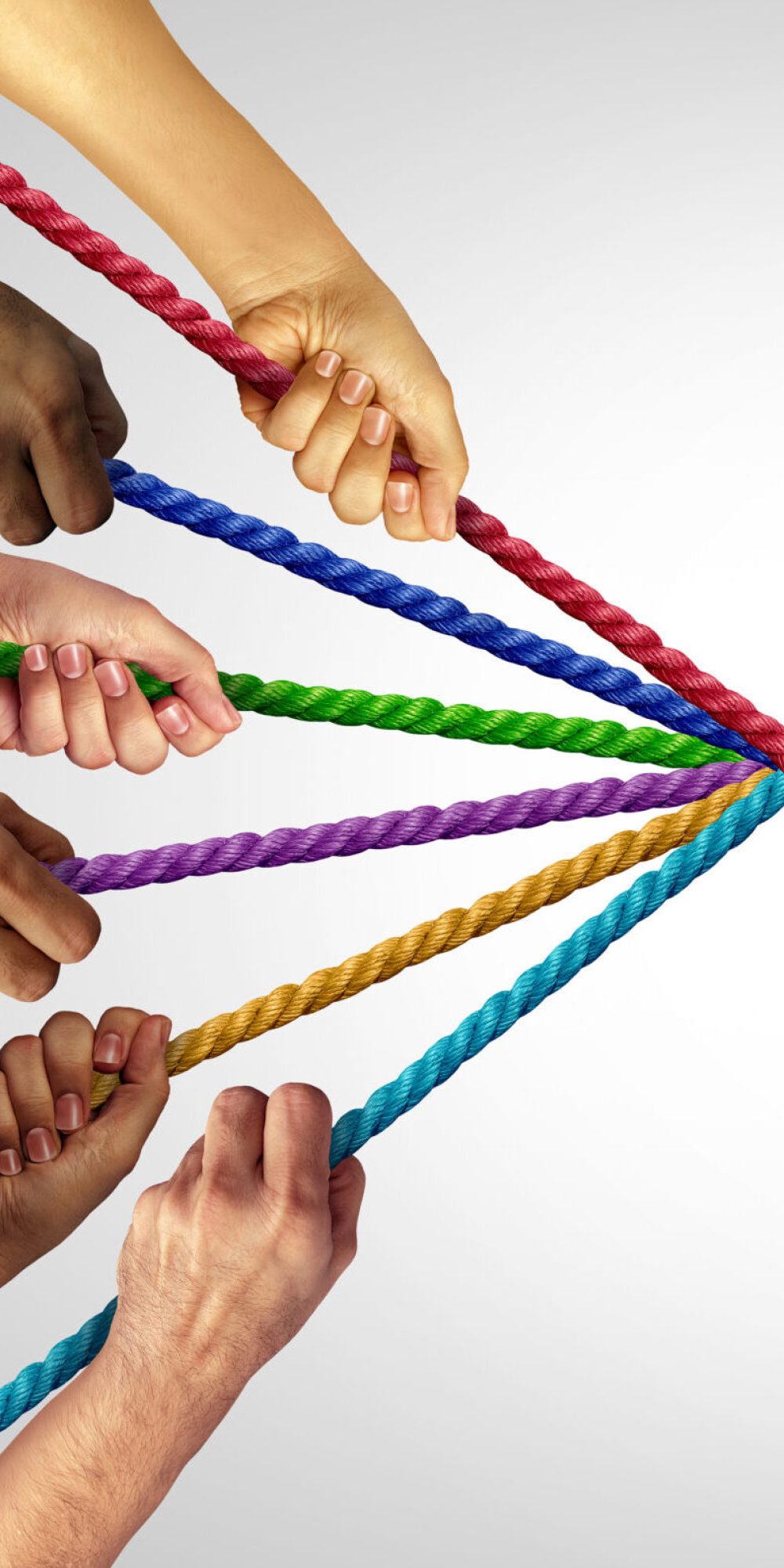 United And Pulling Together as a motivational team building concept with a group representing unity joining as one to combine thier individual strengths for collective success as hands that pull different ropes creating a unified force to succeed.