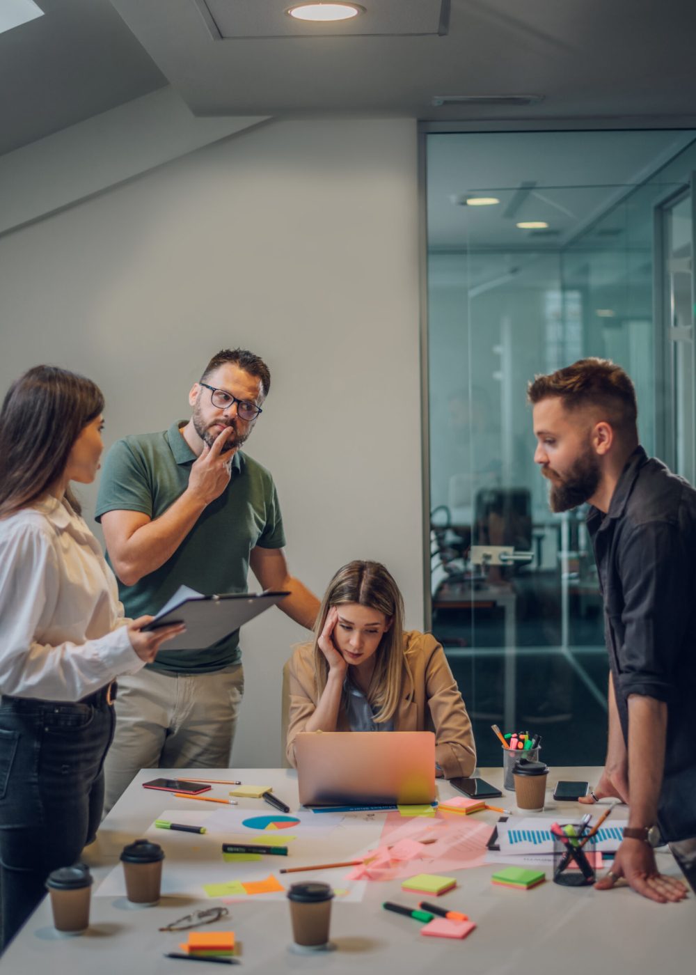 Business team having a meeting in the office and solving a problem. Teamwork, people and crisis concept. Depressed by failure, bad news, feeling desperate about company bankruptcy or financial crisis.